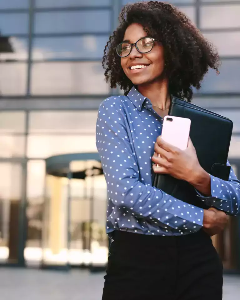 Woman with cellphone and portfolio