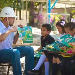 Man with bok and children